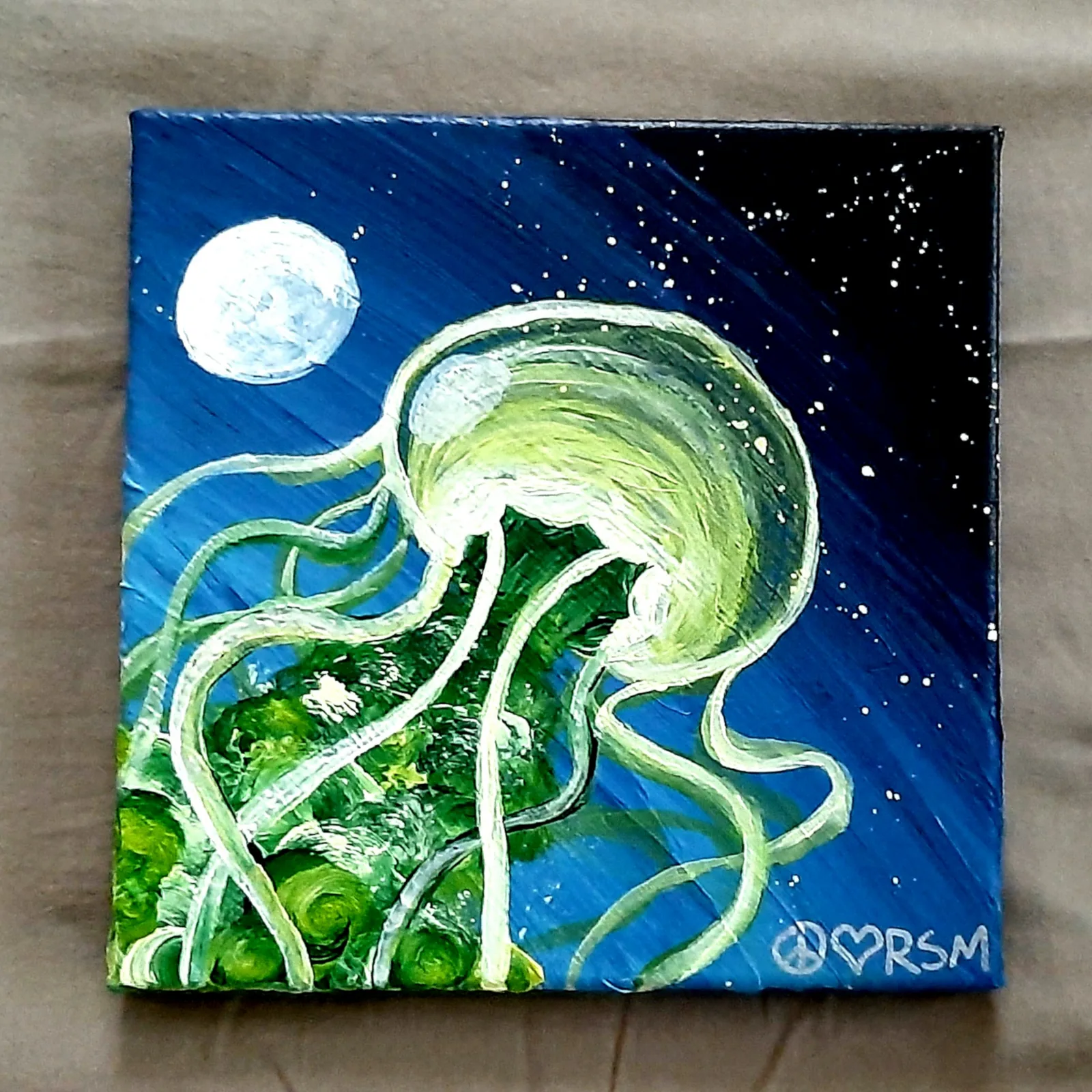 Painting of a green jellyfish floating in a starry night sky beside the moon