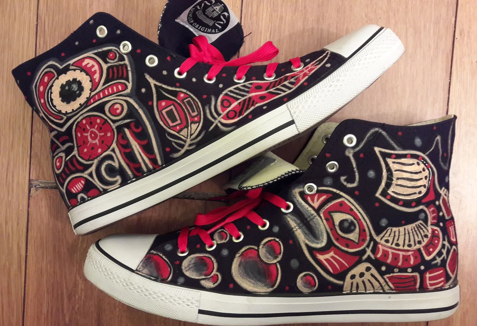 Red and black Pacific Northwest style painted sneakers