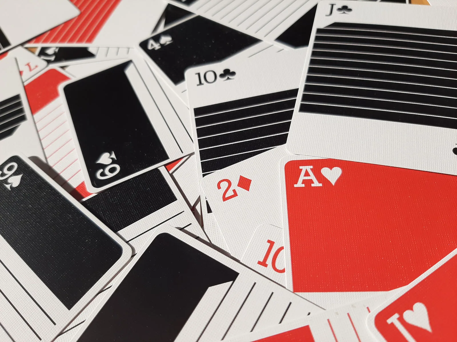 Red and black Pinstripe cards scattered face up