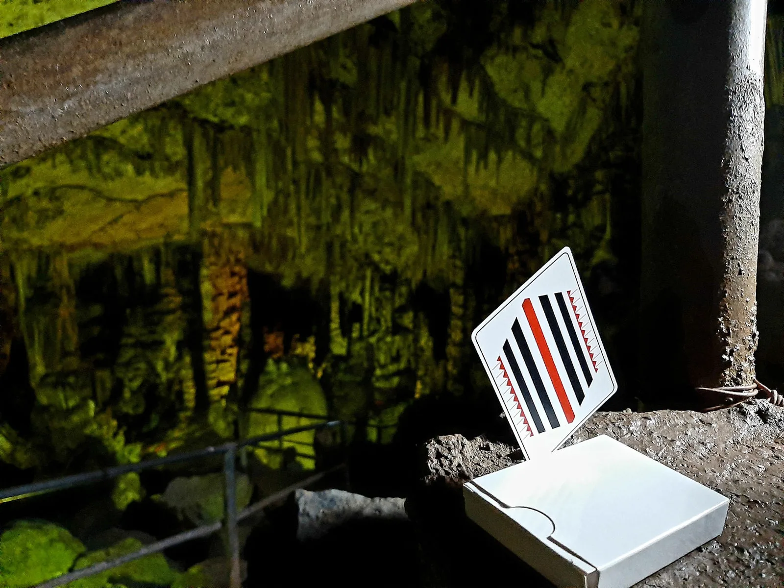 Pinstripe deck in its box on a ledge in a mossy cave