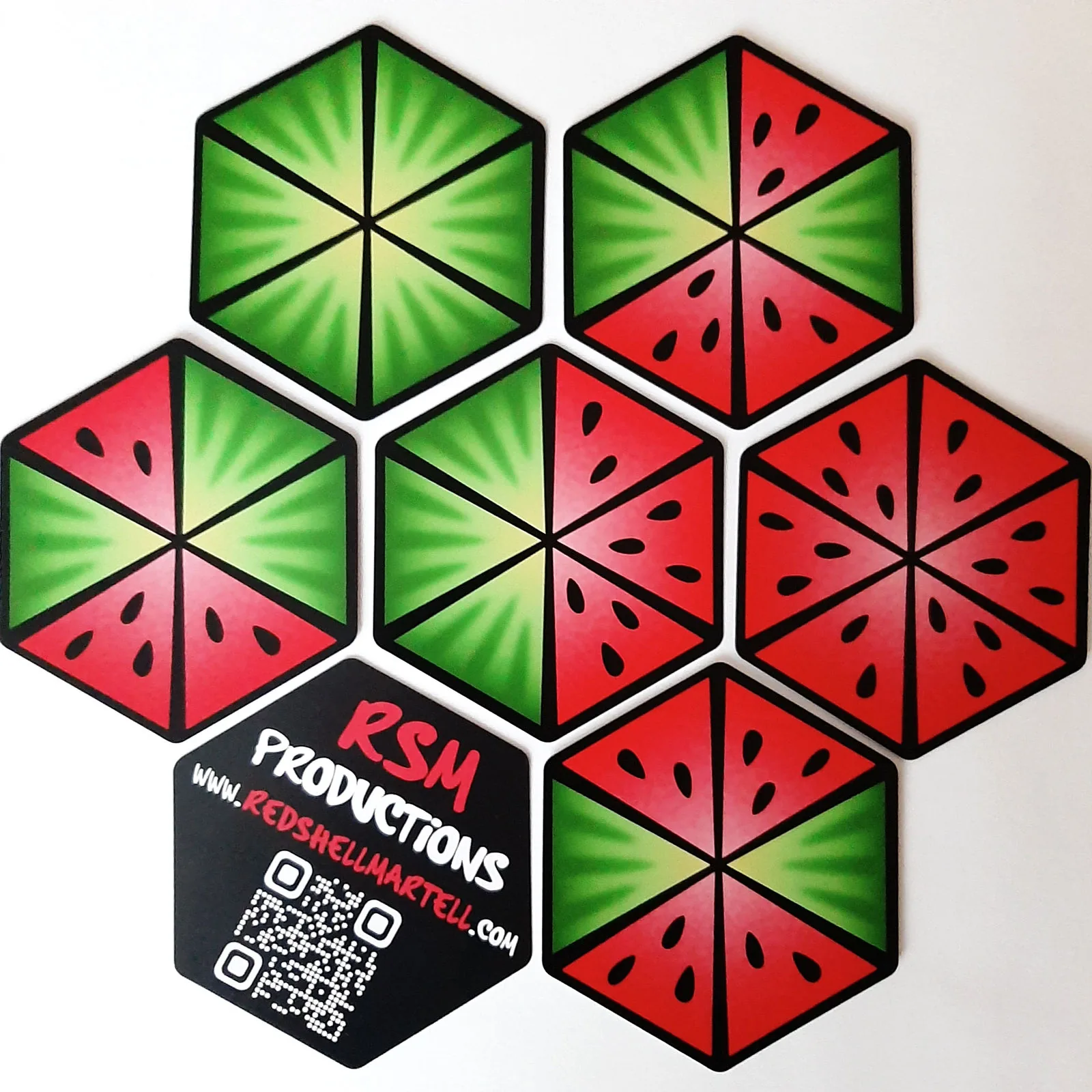 Seven watermelon tiles arranged around an RSM Productions card
