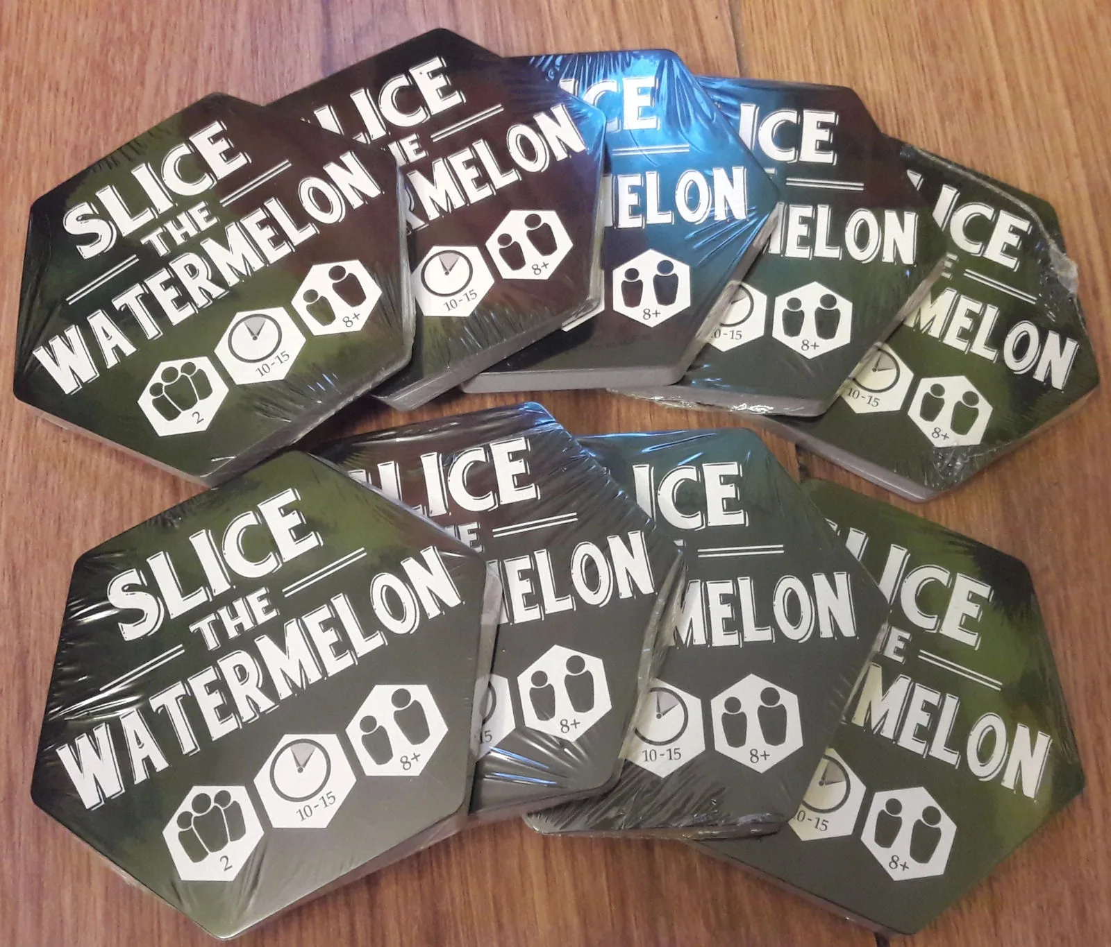 Stacks of shrink-wrapped hexagon game packs